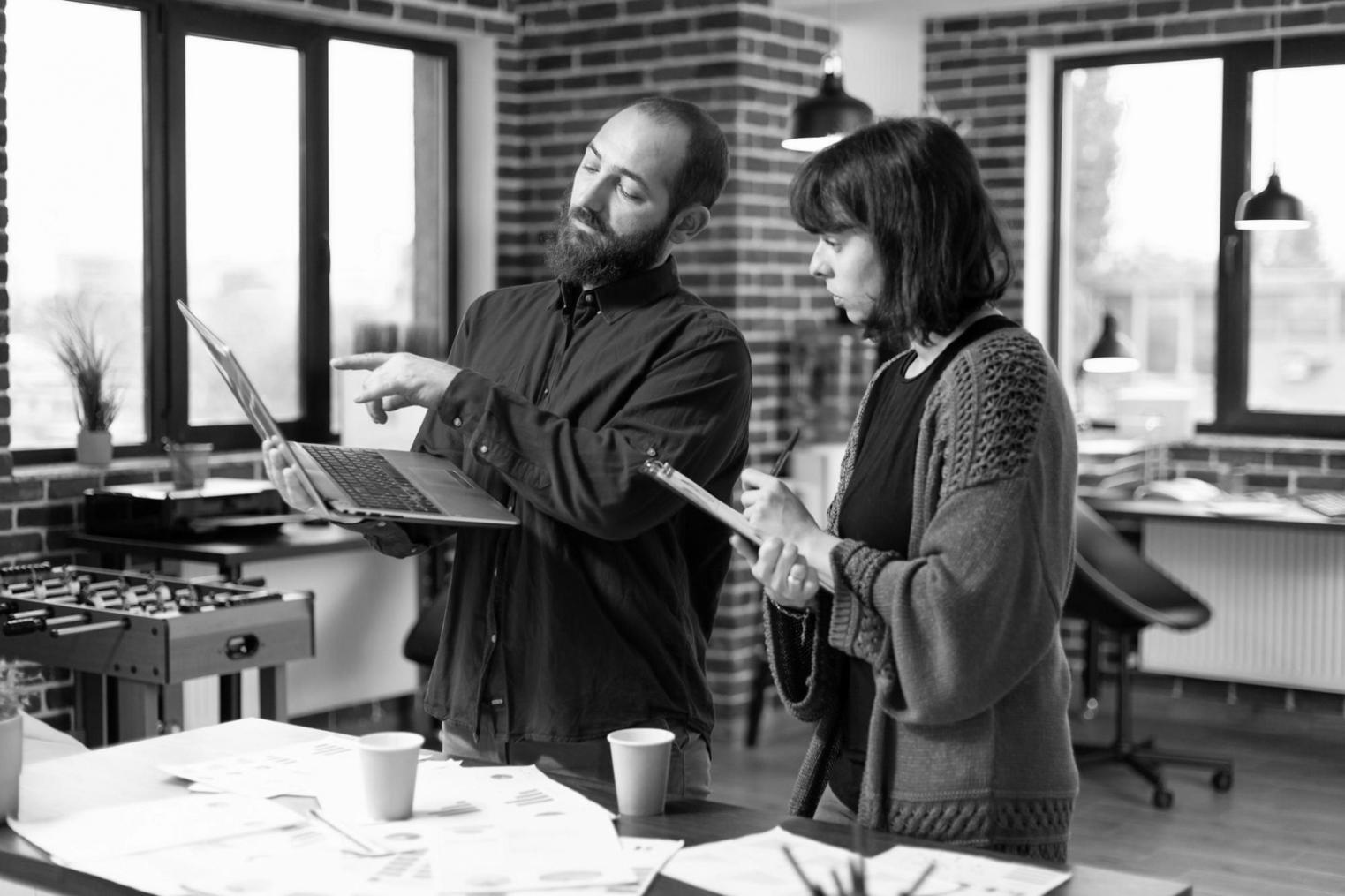 Close-up of hands reviewing financial charts and budget documents